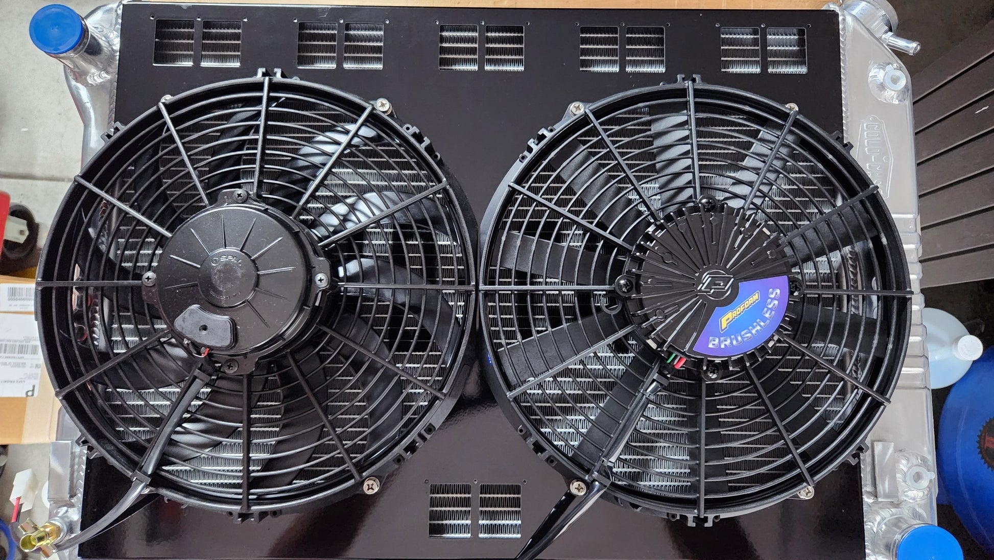 Custom Cold Case Radiator CHC11 with custom Black Fan Shroud, one 12 inch Spal, and one 12 inch Proform fits 1967 to 1969 GM F Body's Gloss Black