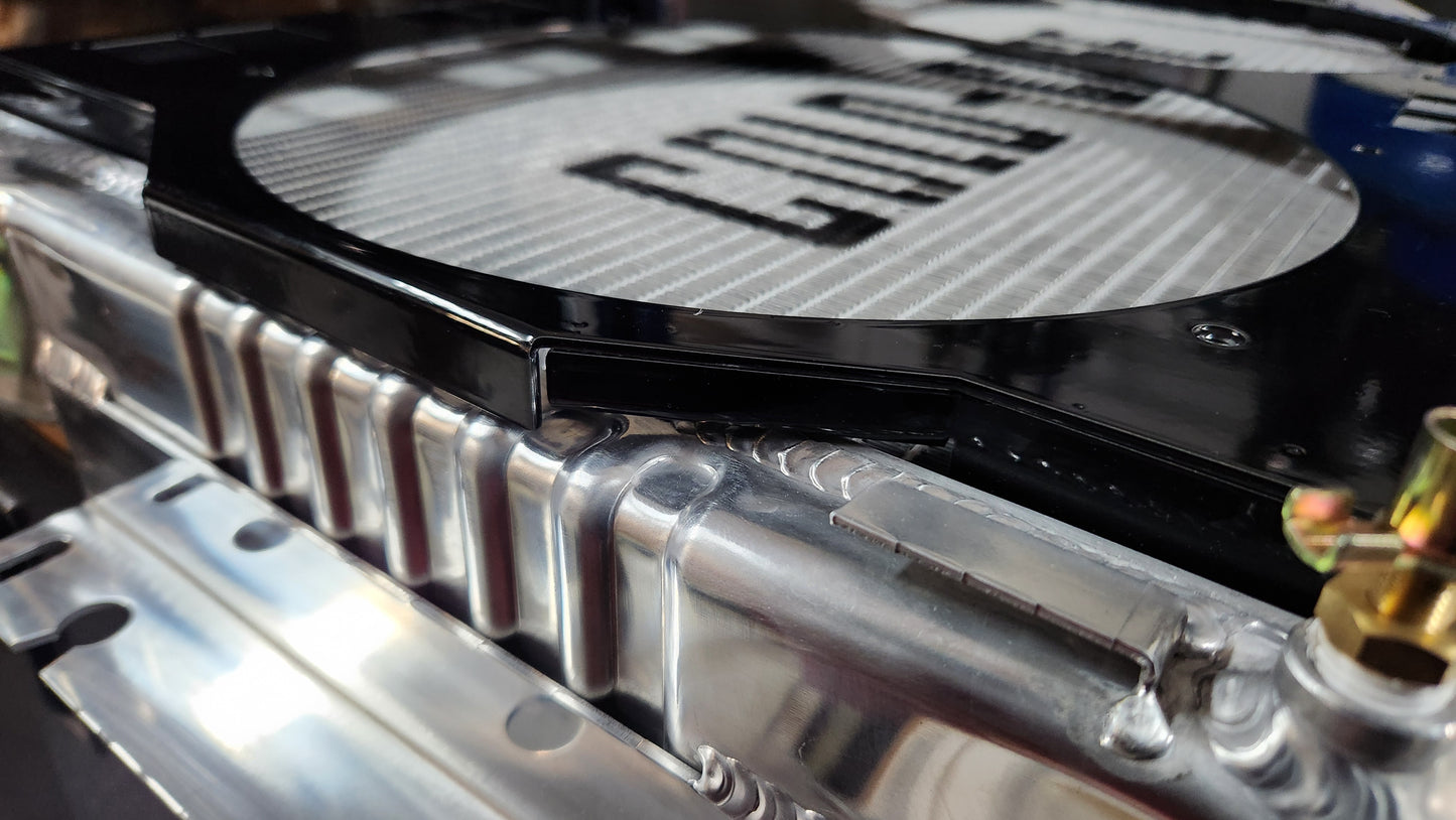 Weld overhang on a Cold Case Radiator CHC11 with custom Black Fan Shroud fits 1967 to 1969 GM F Body's