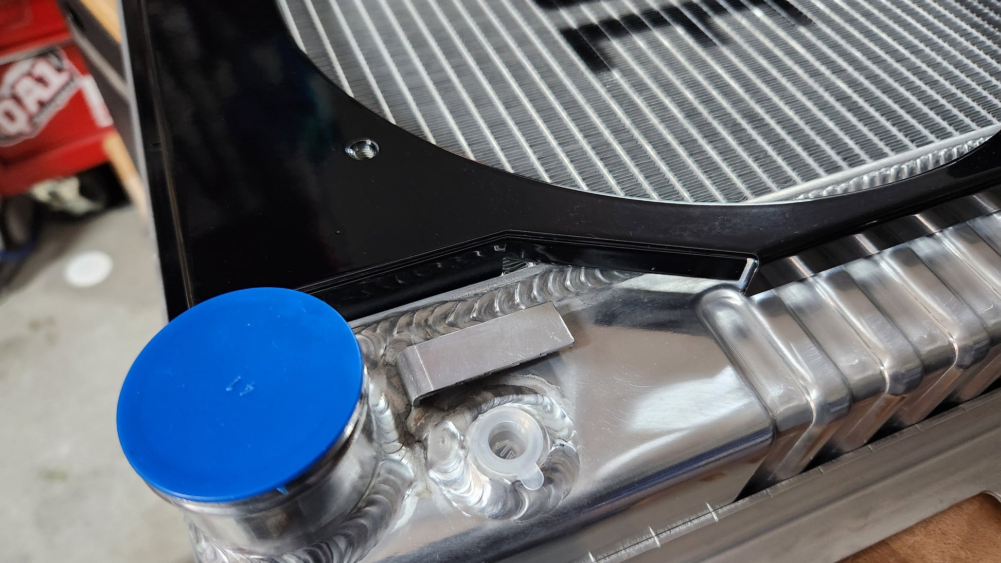Close up view of a Cold Case Radiator outlet on a CHC11 with custom Black Fan Shroud fits 1967 to 1969 GM F Body's Black Gloss
